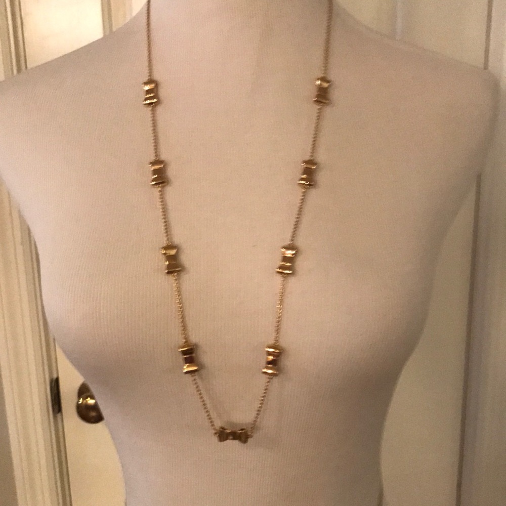 NWT Kate Spade gold take a bow long necklace.